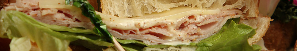 Eating Sandwich Cheesesteak at Cheesesteak Nirvana restaurant in Portland, OR.